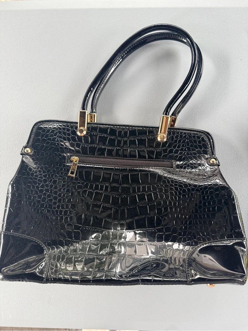Orli Collection Patent Black Croc-Embossed Handbag with Gold Accent